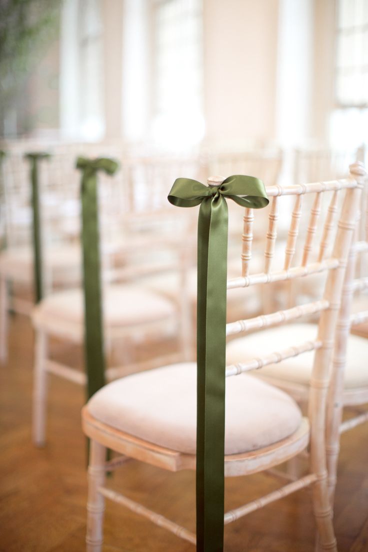 green ribbons decorating the ceremony chairs