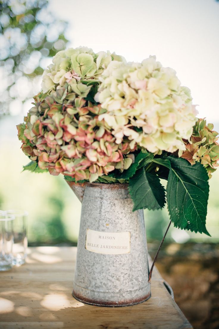 hydrangeas in vintage watering can wedding centerpiece