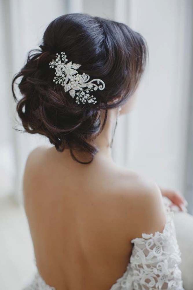 messy wedding updo hairstyle with lace hairpiece