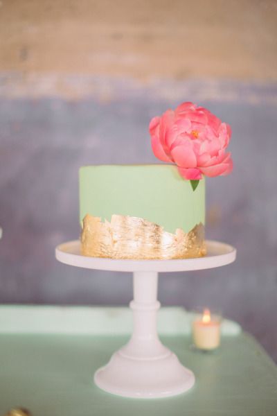 mint and gold mini wedding cake with pink flower