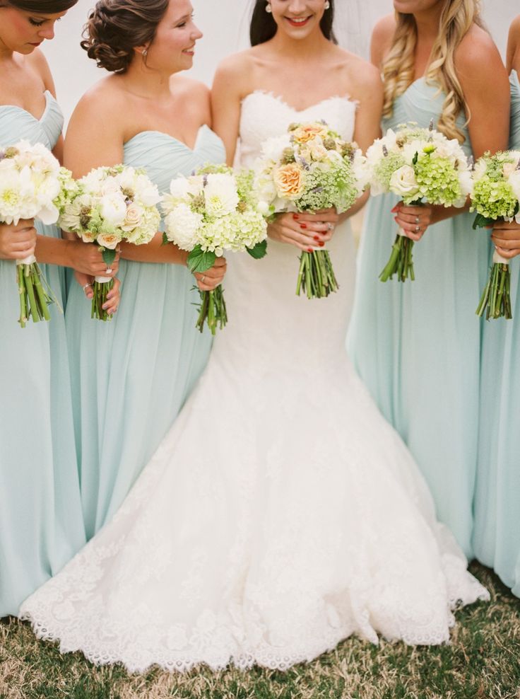 mint green bridesmaid dresses and white wedding bouquets