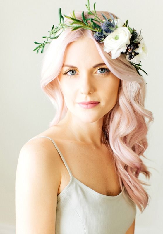 pastel pink wavy wedding hairstyle with white and green hair crown