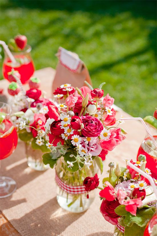 red wedding decor ideas- red roses, wildflowers and strawberries in antique milk glass