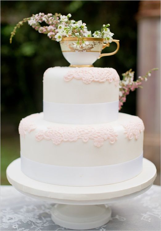 romantic and vintage lace wedding cake with tea cup topper