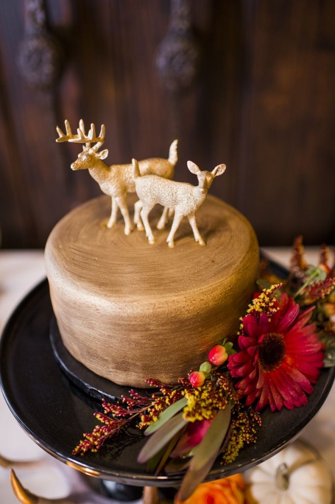 rustic gold wedding cake with deer cake toppers