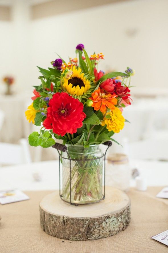 rustic red dahlias and yellow sunflowers wedding centerpiece