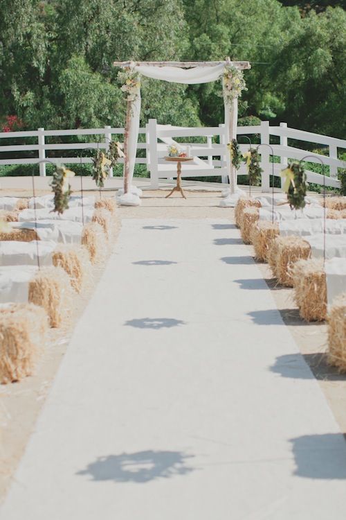 rustic wedding arch & hay bales wedding seating