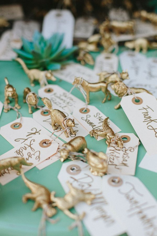 spray paint plastic animals with wedding escort card