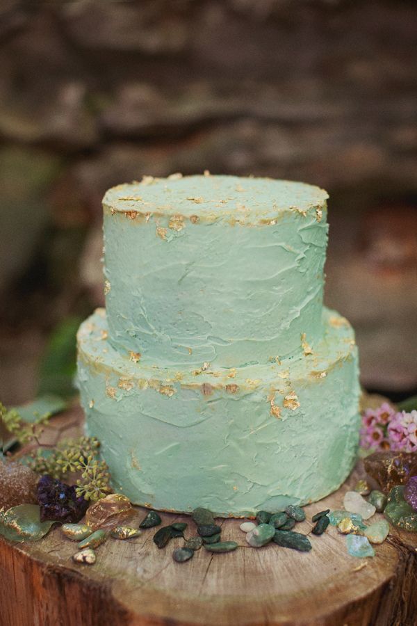 wedding cake in mint and flecked with edible gold leaf