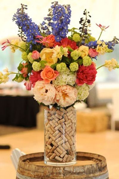 wedding centerpiece with some wine corks in the vase