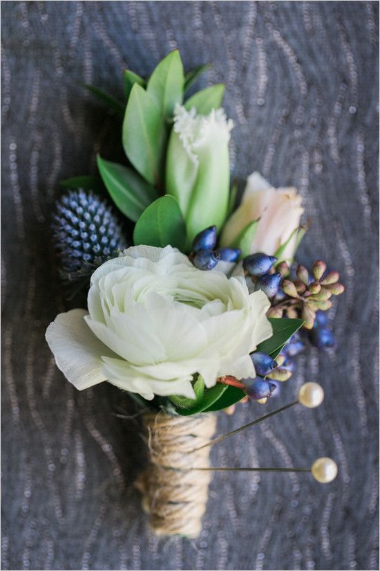 white and blue green boutonniere