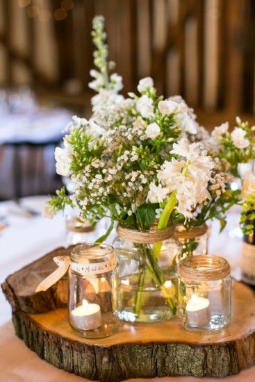 white and green flowers with mason jar wedding centerpiece
