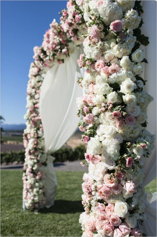 white and pink roses wedding arch alter
