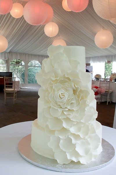 white ruffles white wedding cake