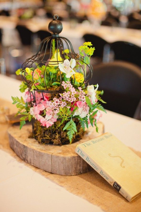 wildflowers in black birdcage on woods centerpiece for rustic wedding