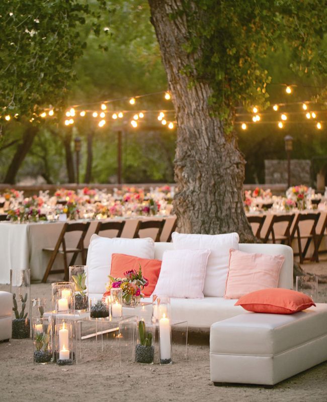 45+ Coral Wedding Color Ideas You Don't Want to Overlook 43 Bistro lights hung over reception tables