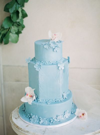 Blue wedding cakes with floral fondant details