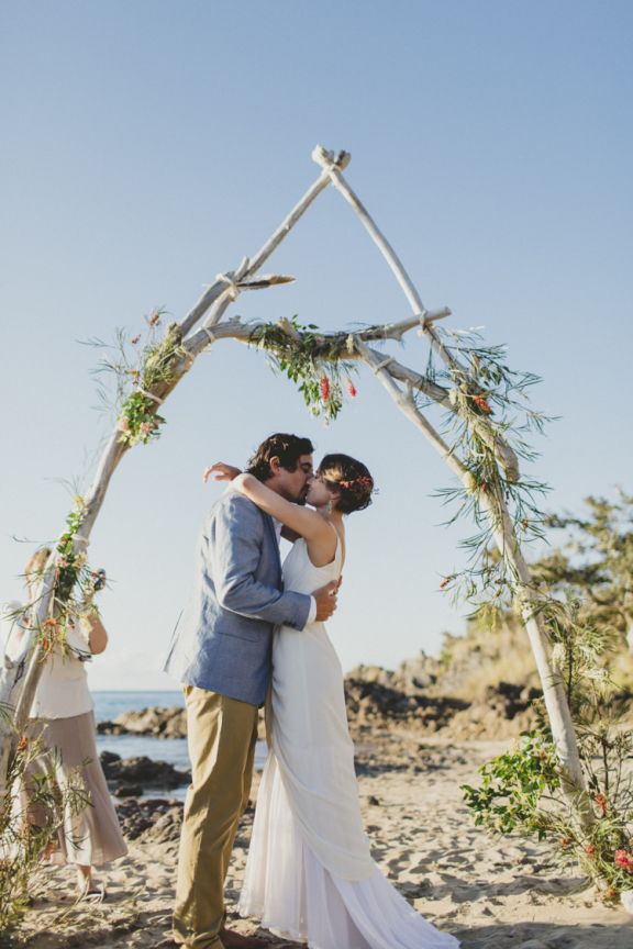 DIY driftwood arbour decorated with native Australian flowers