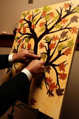 Paint a bare tree and have leaf cut outs for guests to sign then have them attach them to the tree