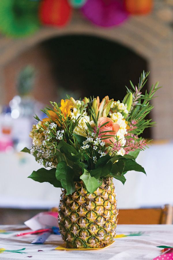 Pineapples and flowers wedding centerpiece