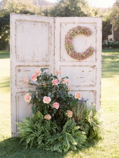Rustic old door and roses wedding decor