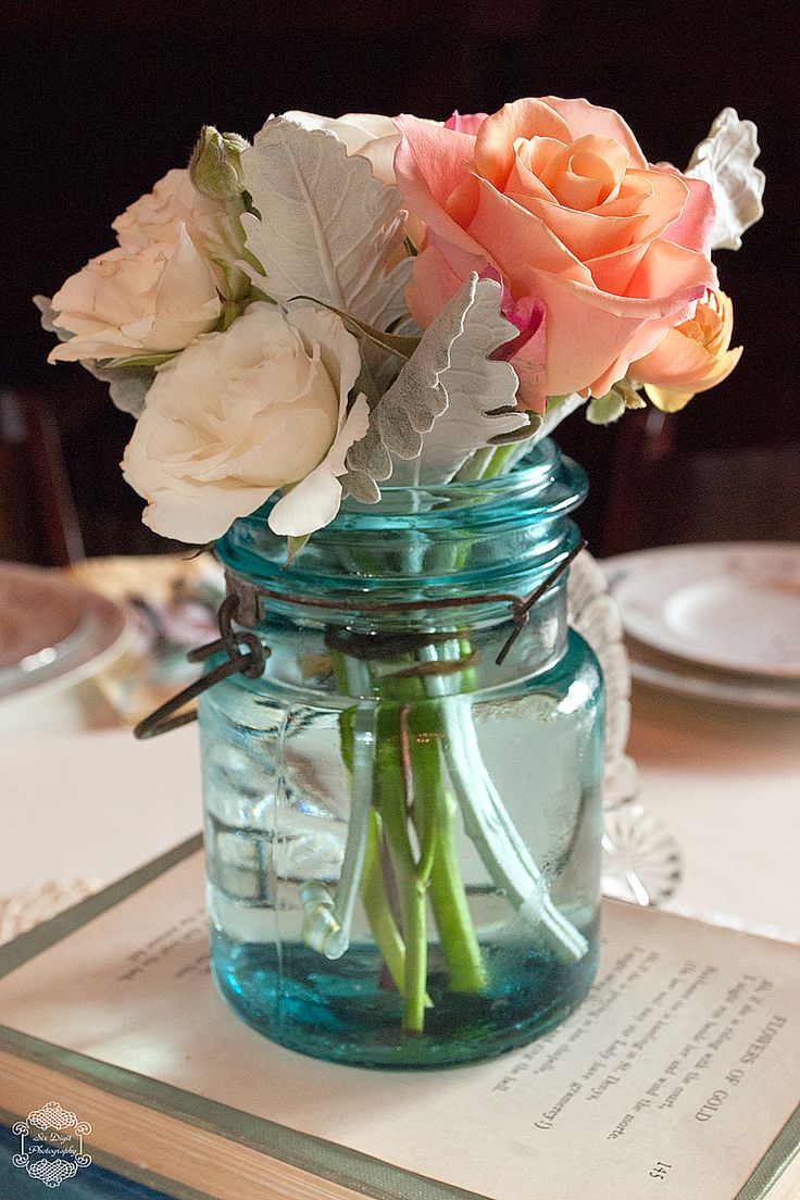 Vintage Wedding Tablescapes using blue mason jar & roses