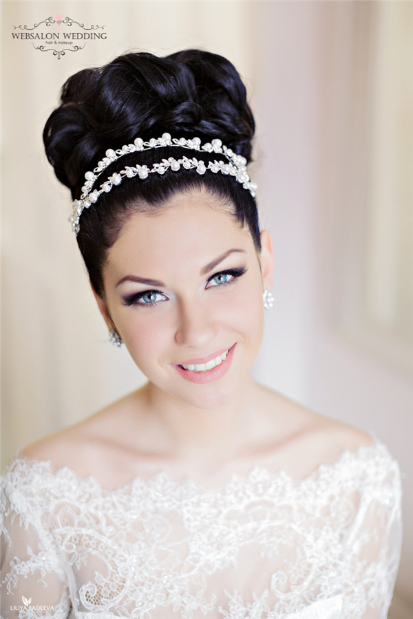 black topknot wedding hairstyle with pearls crown