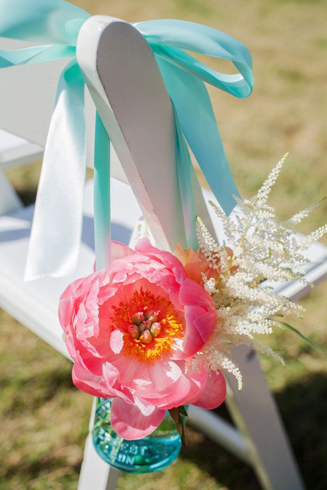 blue mason jars with peonies wedding aisle