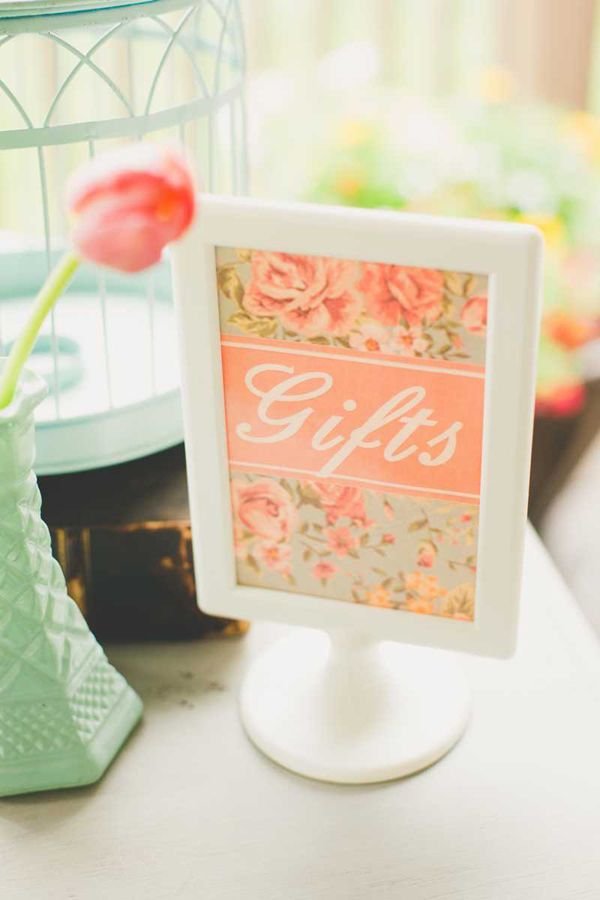 coral frame the gift sign