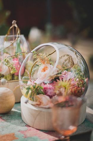 20 Unique Rustic Terrarium Wedding Centerpieces 3 glass bowls filled with pretty petals for an unexpected and sweet centerpiece