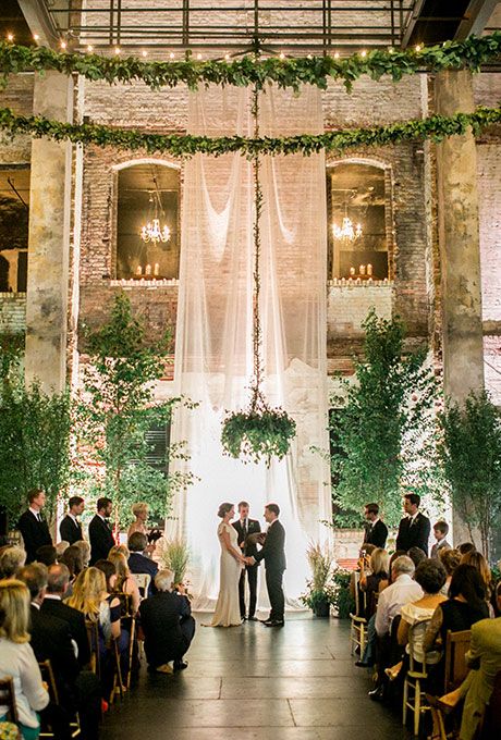 green indoor wedding backdrop