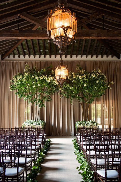 green indoor wedding ceremony backdrop