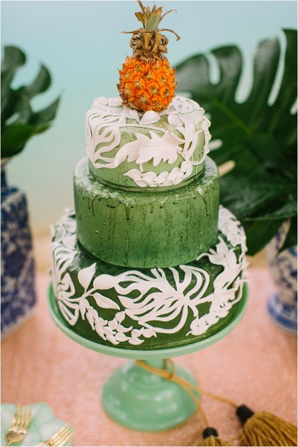 green wedding cake with pineapple topper