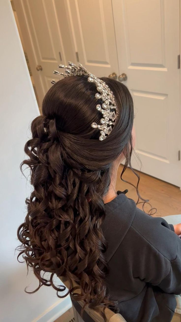 half up half down quinceanera hairstyle with crown