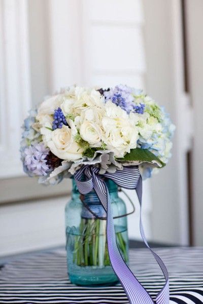 ivory and blue wedding bouquet in blue mason jar