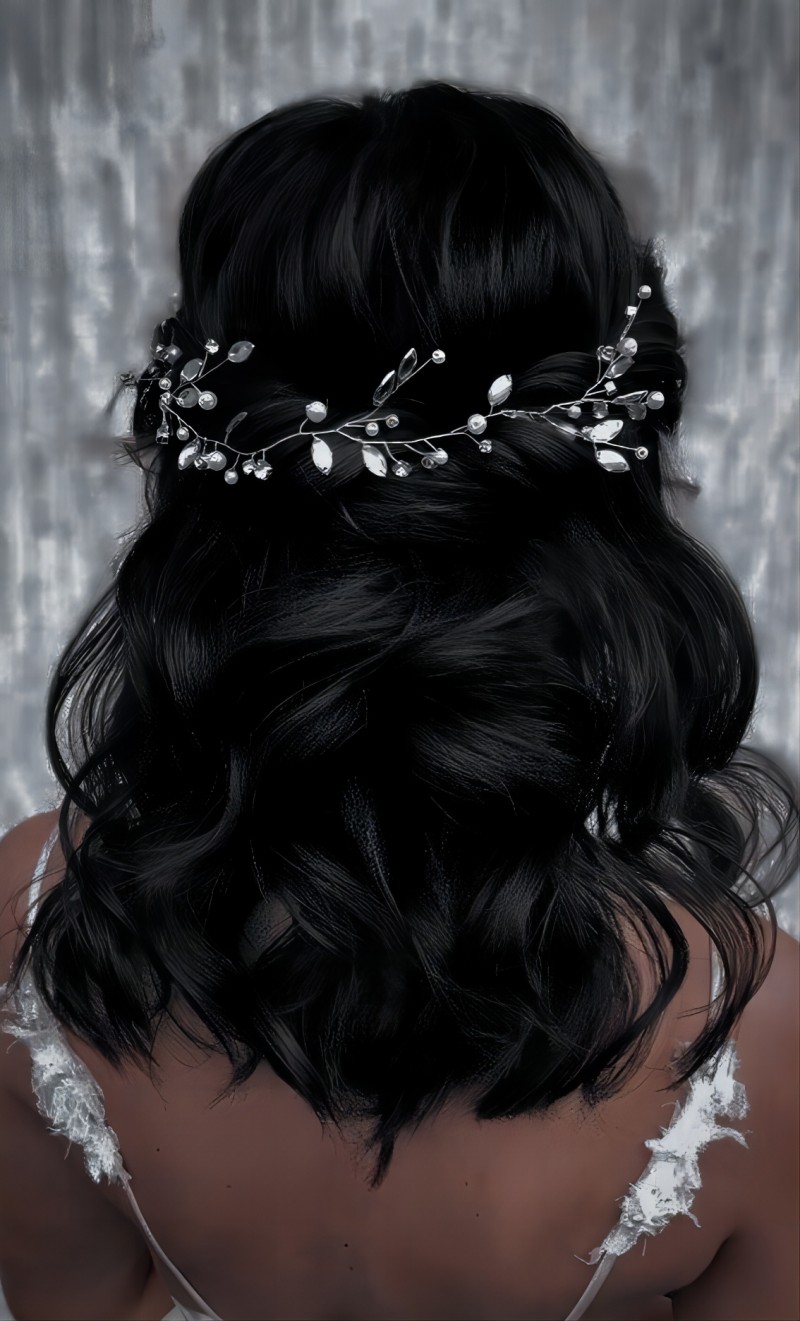 medium length half updo half down quinceanera hairstyle down with a hairpiece