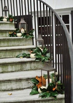 obsessed with this Southern staircase decorated with magnolia leaves