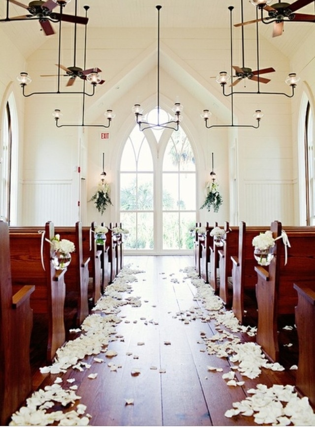 personalize your wedding at a church is to incorporate flower petals scattered on sides