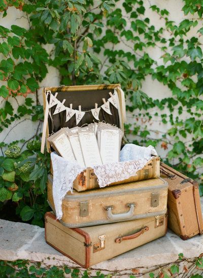 programs held in vintage suitcases