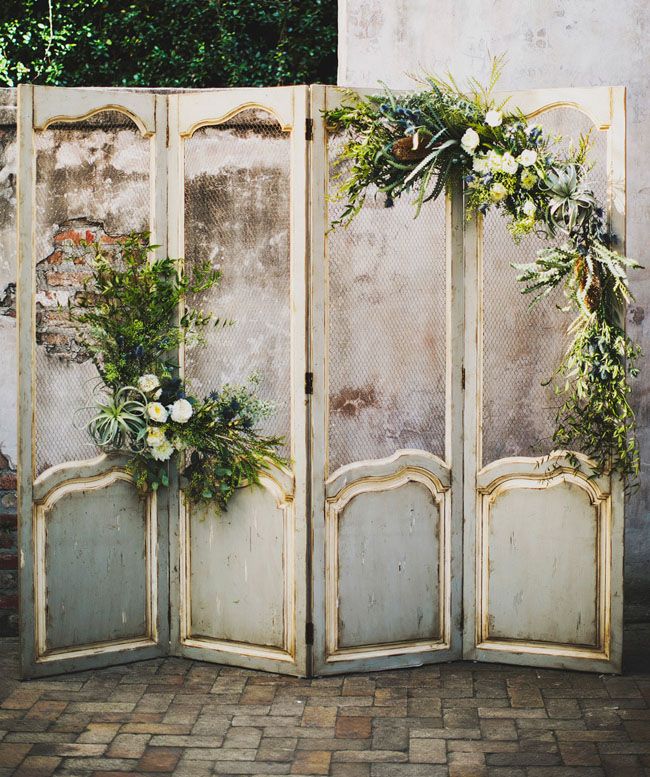 rustic backdrop filled with air plants and mixed greenery