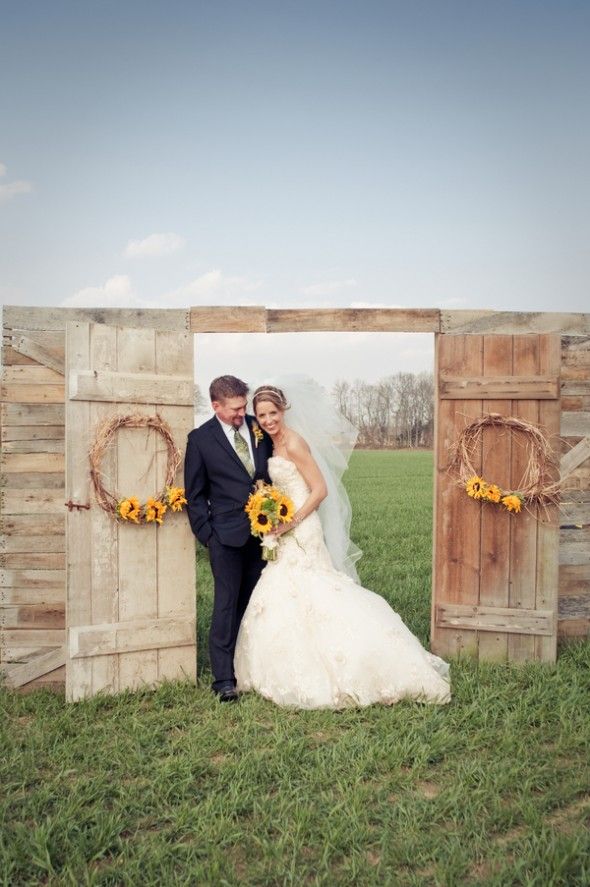 rustic country barn door and suunflowers wedding backdrop