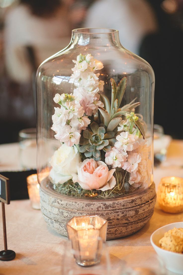 rustic flowers in glass wedding centerpiece