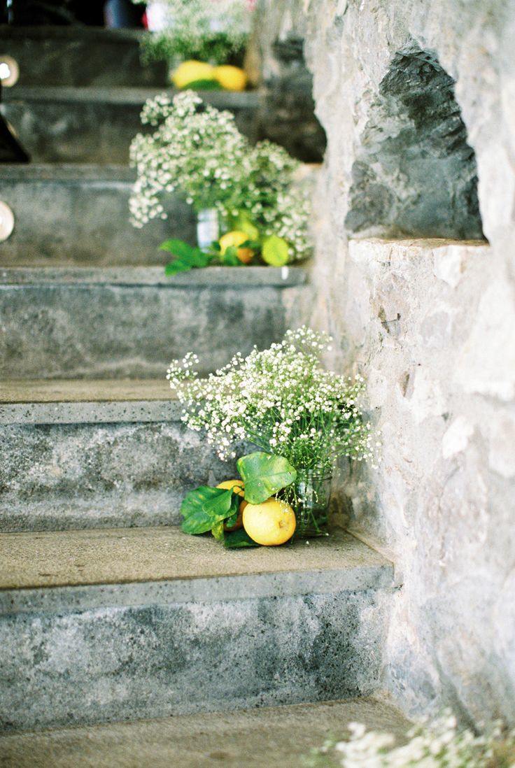 rustic outdoor wedding staircase with baby's breath