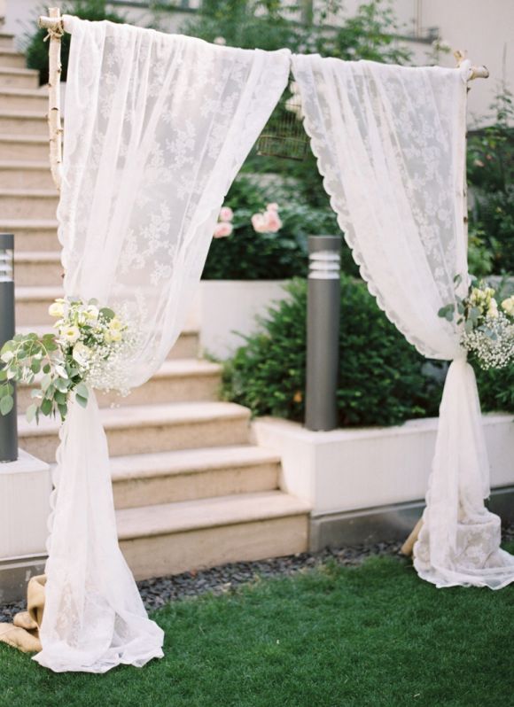 simple birch and lace wedding arbor