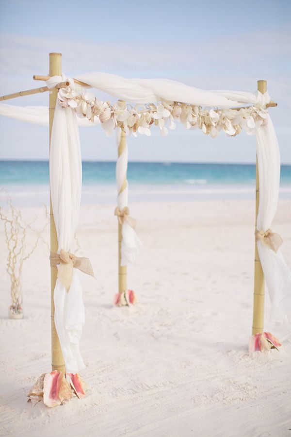 tropical white beach wedding arch