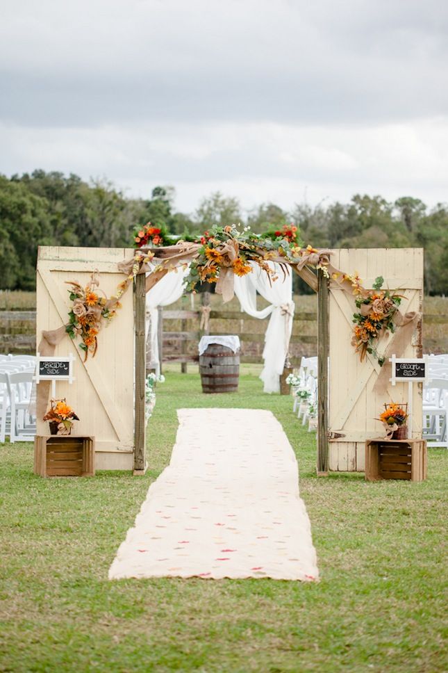 vintage barn doors and sunflowers wedding backdrop