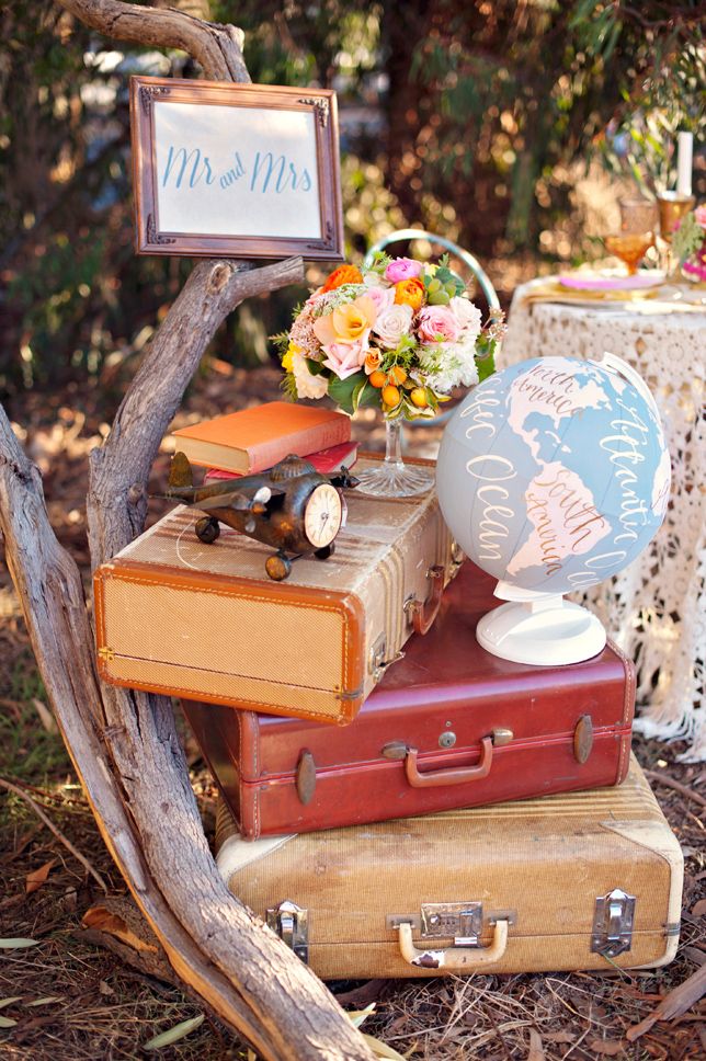 vintage suitcases, airplanes and globes into a travel themed wedding