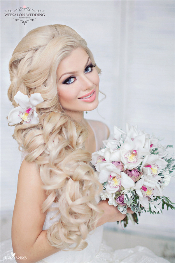 wavy long wedding hairstyle with flower