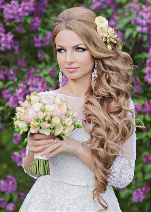 wavy long wedding hairstyle with pastel flowers