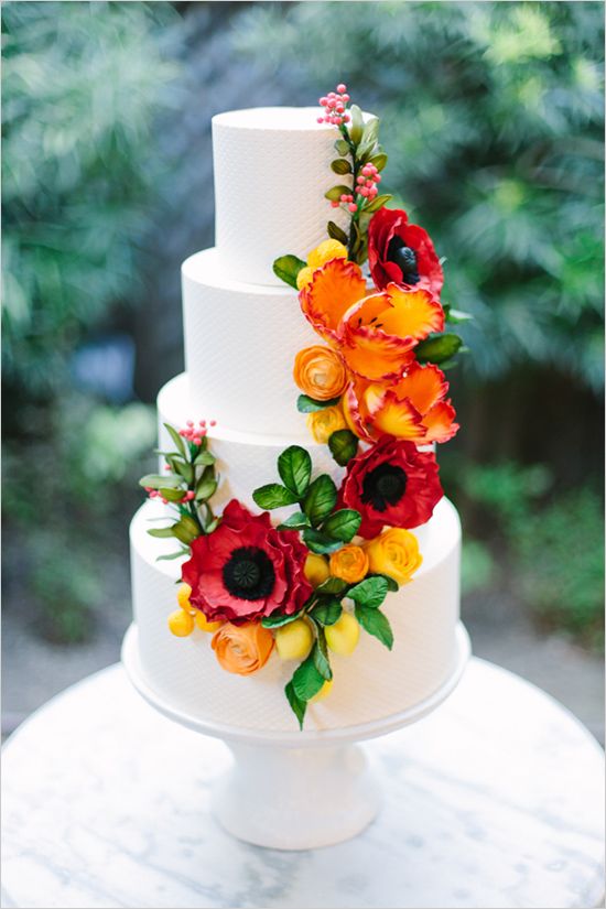 white wedding cake with bold flowers